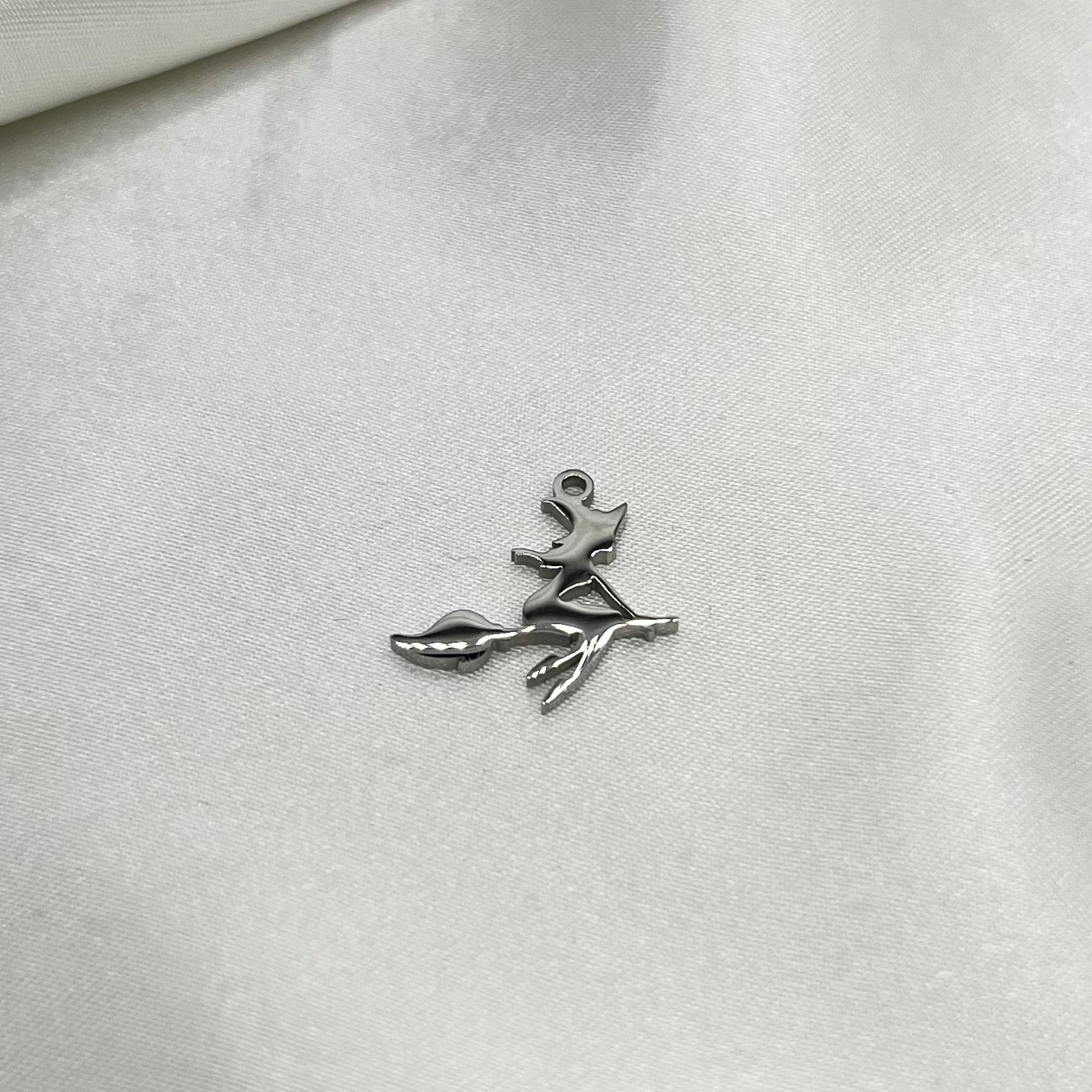 Witch on broom charm